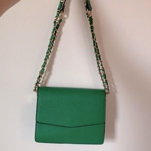 Green purse with adjustable gold and green straps
